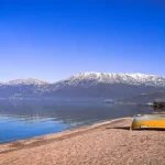 Pogradec-Albania-lakeside-with-fishing-boat_0mtSHKHtzbs-unsplash-1024x509