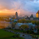 canadian-flag-flying-over-a-picturesque-old-quebec-city-at-sunset-1178972403-4f815bac53bc463fb964be12a96f8072