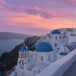 Small-Village-of-Oia-at-sunset,-located-on-Greek-island-of-Santorini,-Greece _iStock-1324871336